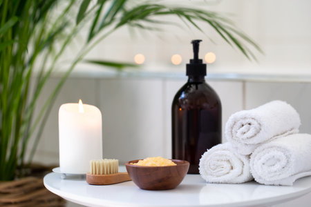 Bathroom with candles and tropical plants, relaxing atmosphereの写真素材