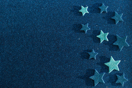 Blue glitter texture with stars holidays background. Macro shotの写真素材