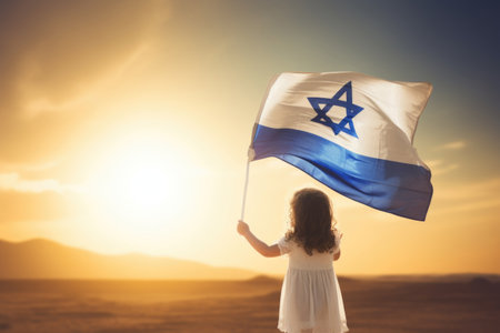 Israeli flag with a star of David in little girl's handsの素材