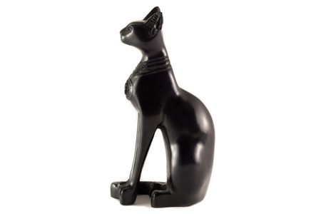 Egyptian statuette of a black cat on a white backgroundの写真素材