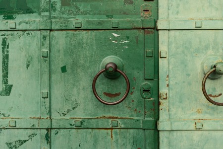 Antique green wrought iron gate with round handles
