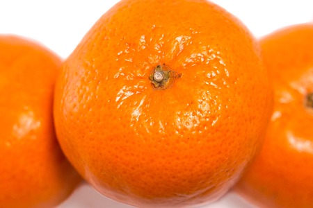 Mandarin and orange, close up with selective focus. Orange peel looks like cellulite in women.の写真素材