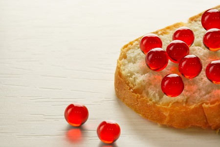 Sandwich with red caviar on white bread on a white tree, selective focusの写真素材