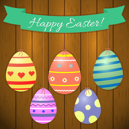 Green ribbon with text and Easter eggs with patterns on a white background. Congratulations on Easter. Vector.のイラスト素材