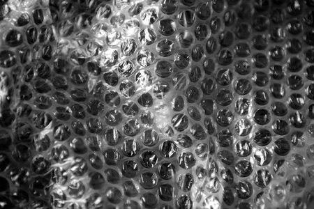 The texture of the packaging air-bubble film on a blue background in full screen