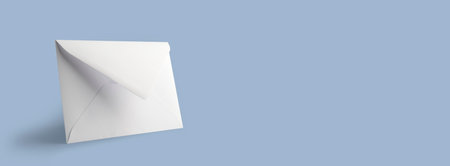 Blank white envelope on a blue background, mockupの写真素材