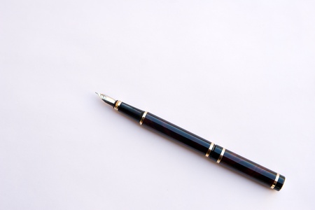 Ink handle rests upon white backgroundの写真素材