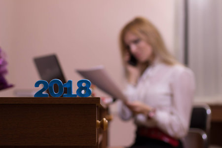 Busy business woman working in an office at holidays