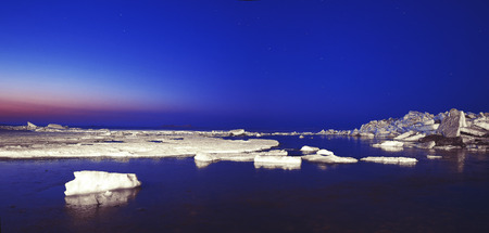 ice ridges at sunrise, winter, sea. panoramic pictureの写真素材