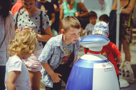 Kiev, Ukraine - June 12, 2017: children talking to a robot on the street in Kievのeditorial素材