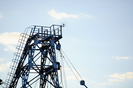 metal tower of gas and oil extraction against the sky.