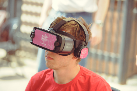 Kiev, Ukraine - June 12, 2017:  young man in glasses of virtual reality at an exhibition on the day of friendship of Ukraine and Canadaのeditorial素材