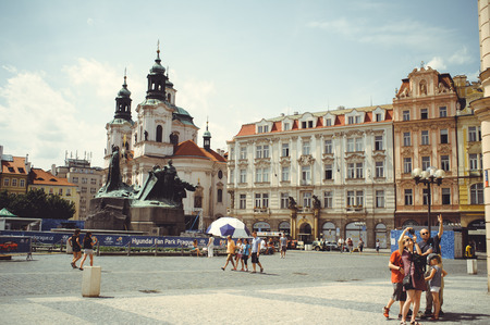 PRAGUE, CZECH REPUBLIC - JUNE 2016: cozy and beautiful tourist street of the Prague's old architecture and people walking, street cafes. a tourist on a bikeのeditorial素材