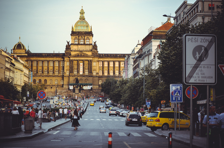 PRAGUE, CZECH REPUBLIC - JUNE 2016: The historical architecture of the Old Town Hall, tourists walk around the squareのeditorial素材