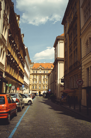 PRAGUE, CZECH REPUBLIC - JUNE 2016: cozy and beautiful tourist street of old architecture parked carsのeditorial素材