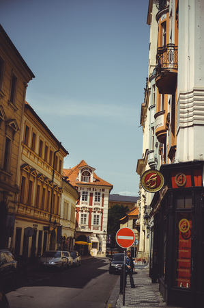 PRAGUE, CZECH REPUBLIC - JUNE 2016: cozy and beautiful tourist street of old architecture parked carsのeditorial素材