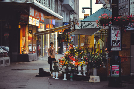 PRAGUE, CZECH REPUBLIC - JUNE 2016: A cozy and beautiful tourist street of old architecture sells flowers, small shops and playgrounds. evening timeのeditorial素材