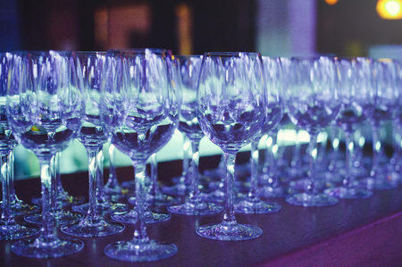 wine glasses in scenic light, preparation for a banquet.の写真素材