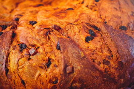 golden bread with raisins close-up, texture of crust of homemade bread.の写真素材
