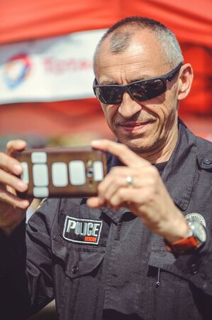 Kiev, Ukraine - MAY, 2017 : police makes a photo on the phone within the security day in Kiev