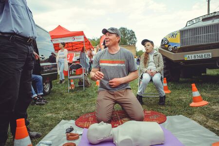 Kiev, Ukraine - MAY, 2017 : police trains first aid of people on the manicure, the visitor makes...