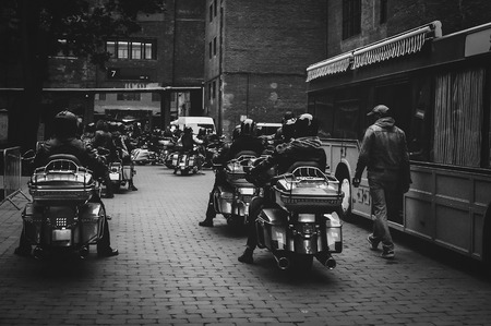 many bikers ride motorcycles at night in the city view from behind, black-and-white night snapshot. freedom of biker movement.の写真素材