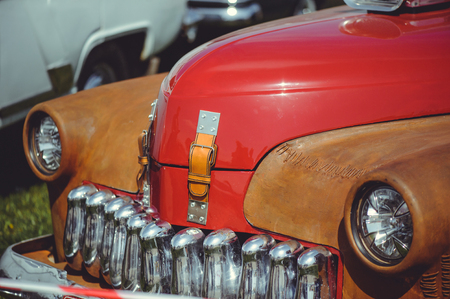 beautiful classic retro car, stylish and luxurious, red with rust inserts.の写真素材