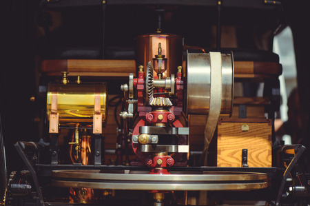 beautiful retro steam engine, polished and well-groomed, made of copper and wood brass, background image of the old mechanism.の写真素材