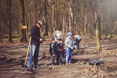 Kiev, Ukraine - APRIL, 2018 : boy with his father on the road radio-controlled models in nature,...