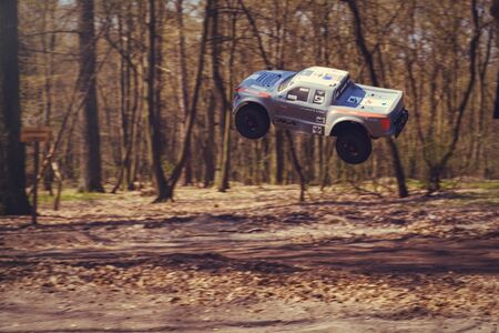 Kiev, Ukraine - APRIL, 2018 : car bashing on the track radio-controlled models flying with a springboard in nature, hobbies and leisure in Kiev, Ukraineのeditorial素材