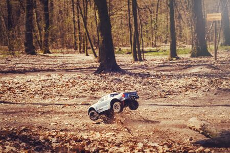 Kiev, Ukraine - APRIL, 2018 : car bashing on the track radio-controlled models flying with a springboard in nature, hobbies and leisure in Kiev, Ukraineのeditorial素材
