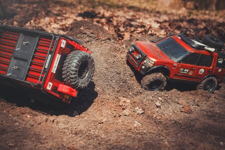 Kiev, Ukraine - APRIL, 2018 : radio-controlled model of an off-road car, trophy crossing the road...