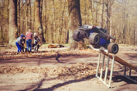 Kiev, Ukraine - APRIL, 2018 : car bashing on the track radio-controlled models flying with a...