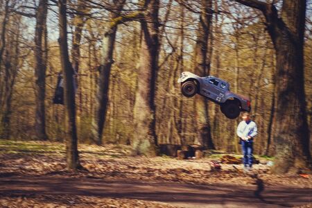 Kiev, Ukraine - APRIL, 2018 : car bashing on the track radio-controlled models flying with a...