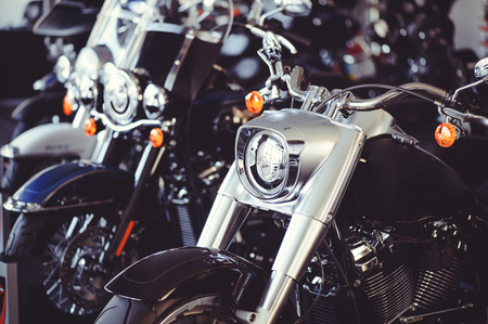 Sale of new motorcycles from the dealer. motorcycles stand in a row sparkle.