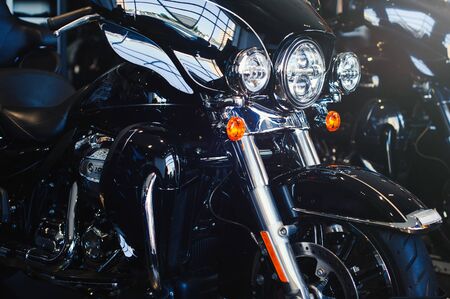 Image of a new motorcycle in a store. Motorcycles and accessories in a modern motorcycle store. Very cool motorcycle in a car dealership. Concept for motorcycle sale or motorcycle purchase.の写真素材