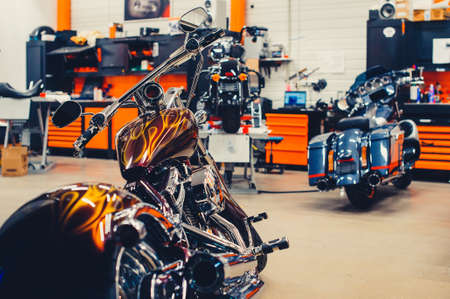 motorcycle repair shop, chrome exhaust pipes and engine, concept service and repairの写真素材