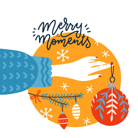 Trendy square greeting postcard with female hand holding Christmas toy. Woman decorates the xmas tree with glass balls. Flat vector illustration with lettering Merry moments.のイラスト素材