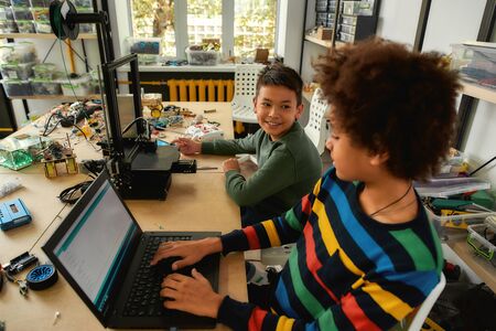 Appreciation for innovation. Students building and learning to program robot vehicle at a stem...