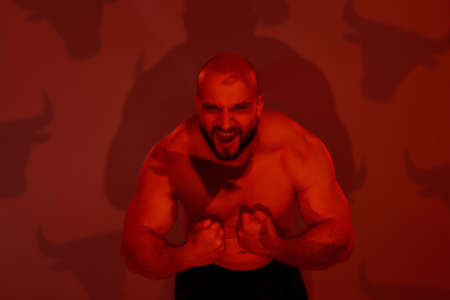 Young brutal caucasian muscle man screaming out