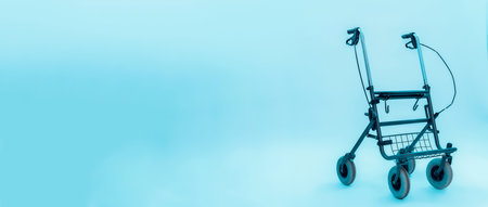 Walker for special child with cerebral palsy isolated over abstract blue background. Disabled children conceptの写真素材