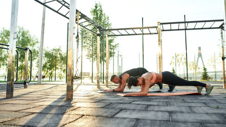 General view of sport playground with couple of athletes