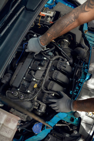 Top view of mechanic working with car engineの写真素材