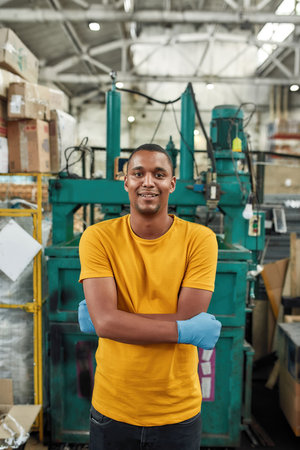 African american man on compressing machine backgroundの写真素材