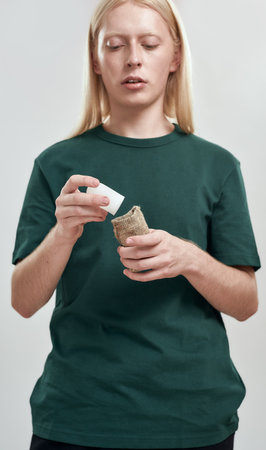 Young caucasian man putting crystal deodorant into bag
