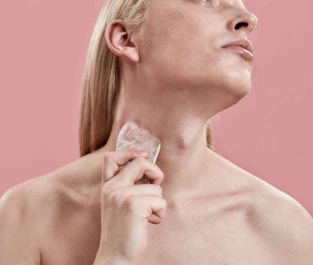 Young caucasian boy using quartz tool for massage