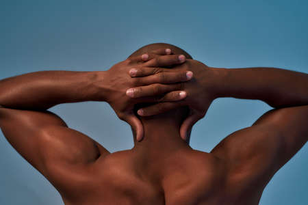 Person locking fingers behind the head backの写真素材
