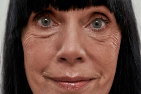 Portrait of middle aged caucasian woman with black hair