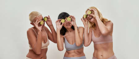 Ladies are fooling around with lime circlesの写真素材