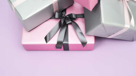 Preparing for Womens or Mothers day. Many colorful wrapped gift boxes on a purple backgroundの写真素材